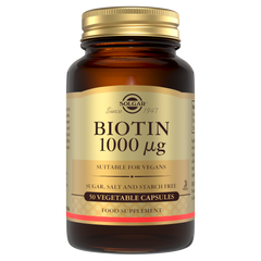 Glass bottle of Solgar Biotin 1000 µg supplements with a gold lid