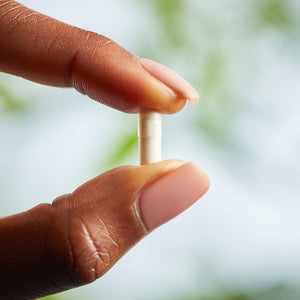 Solgar Biotin 1000 µg capsule in a person's hand