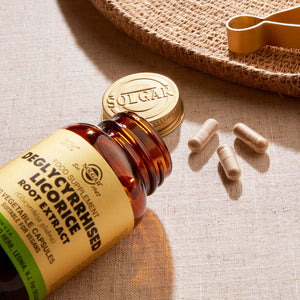 Solgar Deglycyrrhised Licorice Root Extract vegetable capsules in a glass bottle on a table