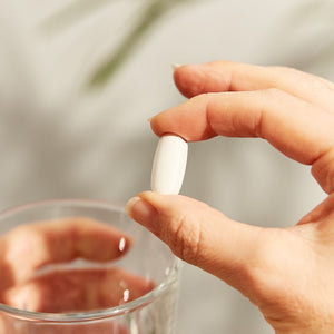 Solgar L-Lysine supplement in a person's hand