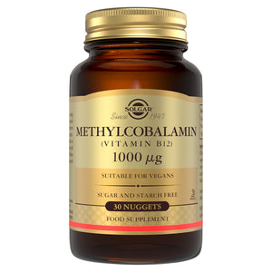 Solgar Methylcobalamin vitamin B12 nuggets in a glass jar with a gold lid
