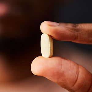 Solgar Ultimate Calm Tablet in a person's hand