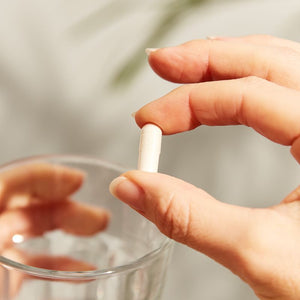 Solgar Vitamin C 500mg capsules in a person's hand