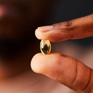 Solgar vitamin d3 1000iu softgel in a person's hand