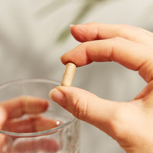 Solgar Ashwagandha Root Extract Vegetable Capsule in a person's hand