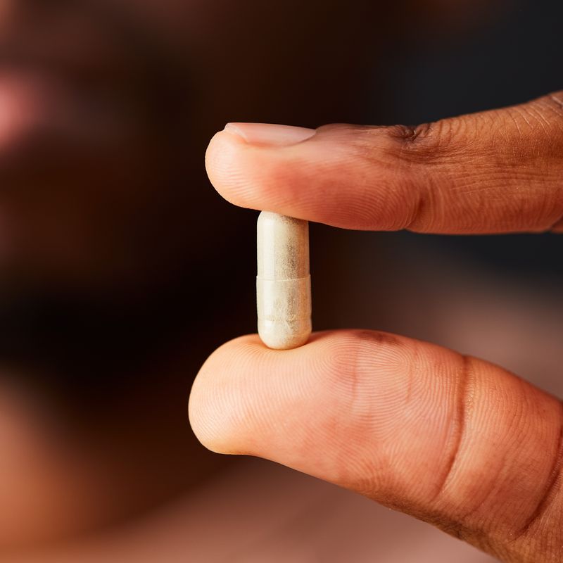 Solgar Ester-C Plus 500 mg Vitamin C in a persons hand