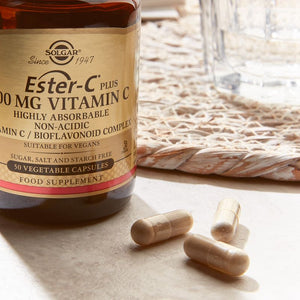 Solgar Ester-C Plus 500 mg Vitamin C in a glass bottle on a table