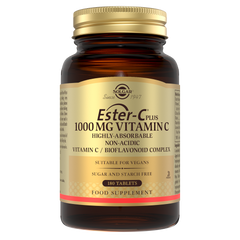 Solgar ester c vitamin c tablets in a glass jar with a gold lid