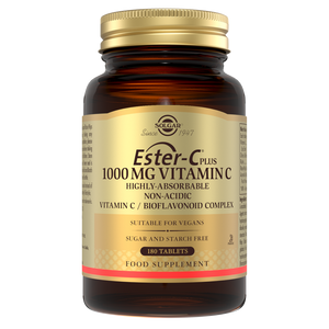 Solgar ester c vitamin c tablets in a glass jar with a gold lid
