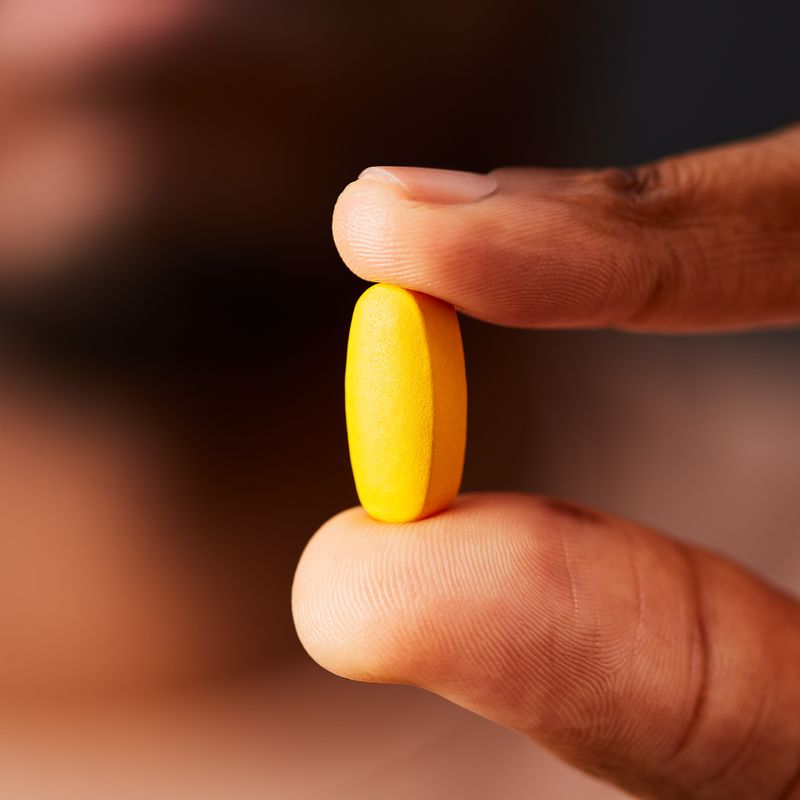 Solgar Formula VM-75 Multivitamin Tablet in a person's hand