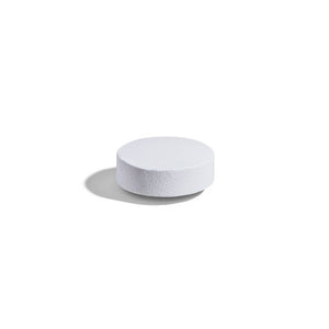 Singular Solgar magnesium with vitamin B6 supplement on a white surface