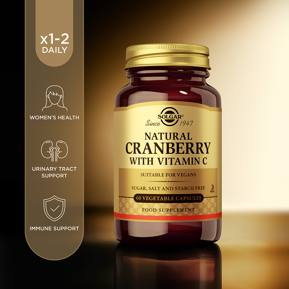 Solgar Natural Cranberry with Vitamin C vegetable capsules in a glass bottle with product information beside it