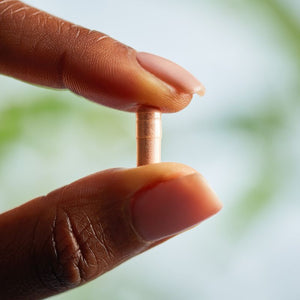 Solgar Pycnogenol 100 mg containing 30 vegetable capsules in a person's hand