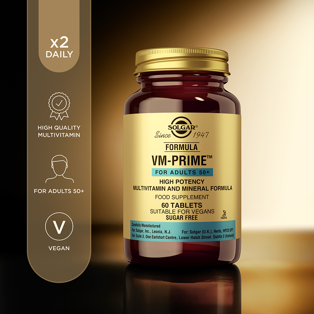 Solgar VM-PRIME multivitamin tablets in a glass bottle with some product information beside it