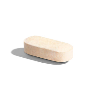 Singular Solgar VM-PRIME multivitamin tablet on a white surface