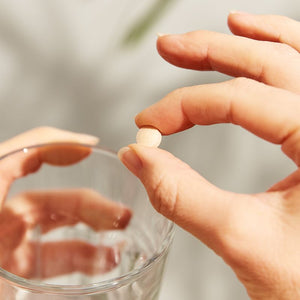 Solgar MenoPrime Menopause Tablet in a person's hand