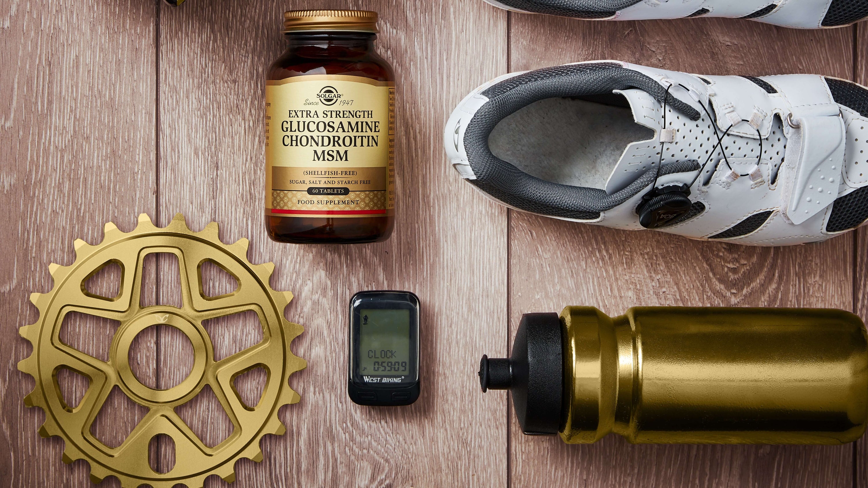 Solgar Glucosamine MSM tablets next to running trainers and a water bottle