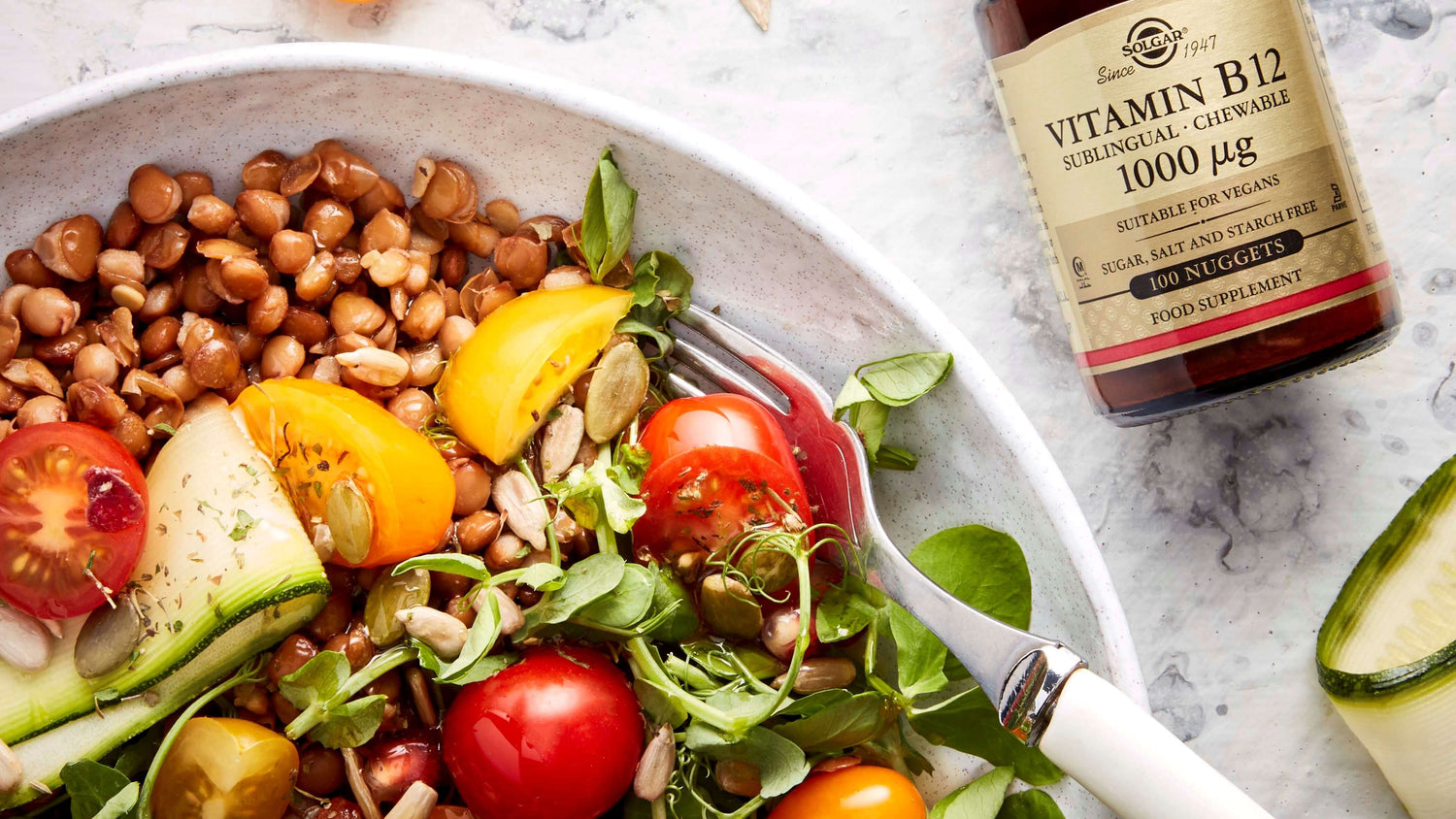 Solgar Vitamin B12 Tablets on a table next to a bowl of foods high in Vitamin B12