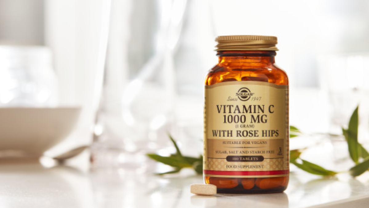 Solgar Vitamin C with rose hips tablets on a dining table 