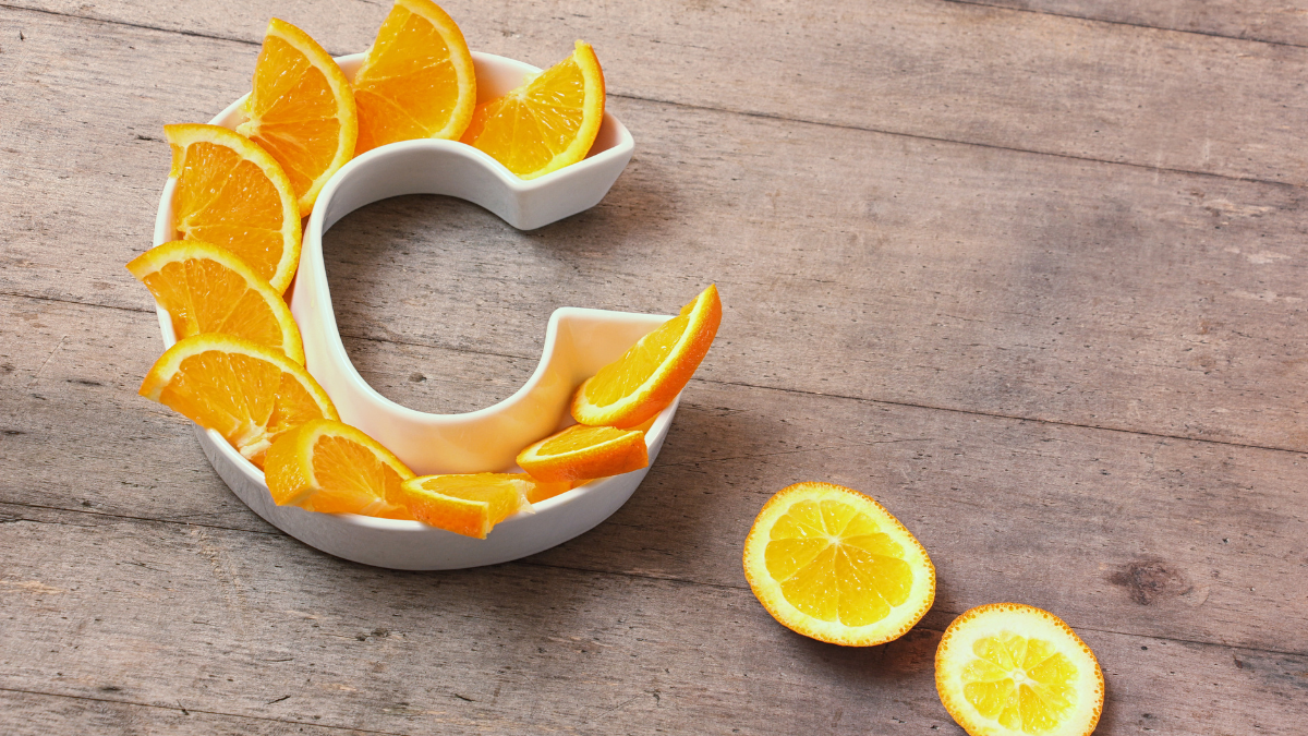 Orange slices in a white dish symbolising Vitamin C