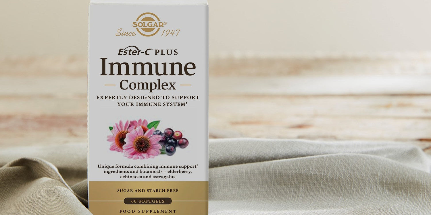 Solgar Ester-C Plus Immune Complex Capsules on a linen blanket against a natural background