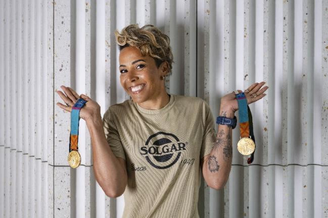 Dame Kelly Holmes, the official Ambassador for the Solgar® Wellness Partnership with a medal