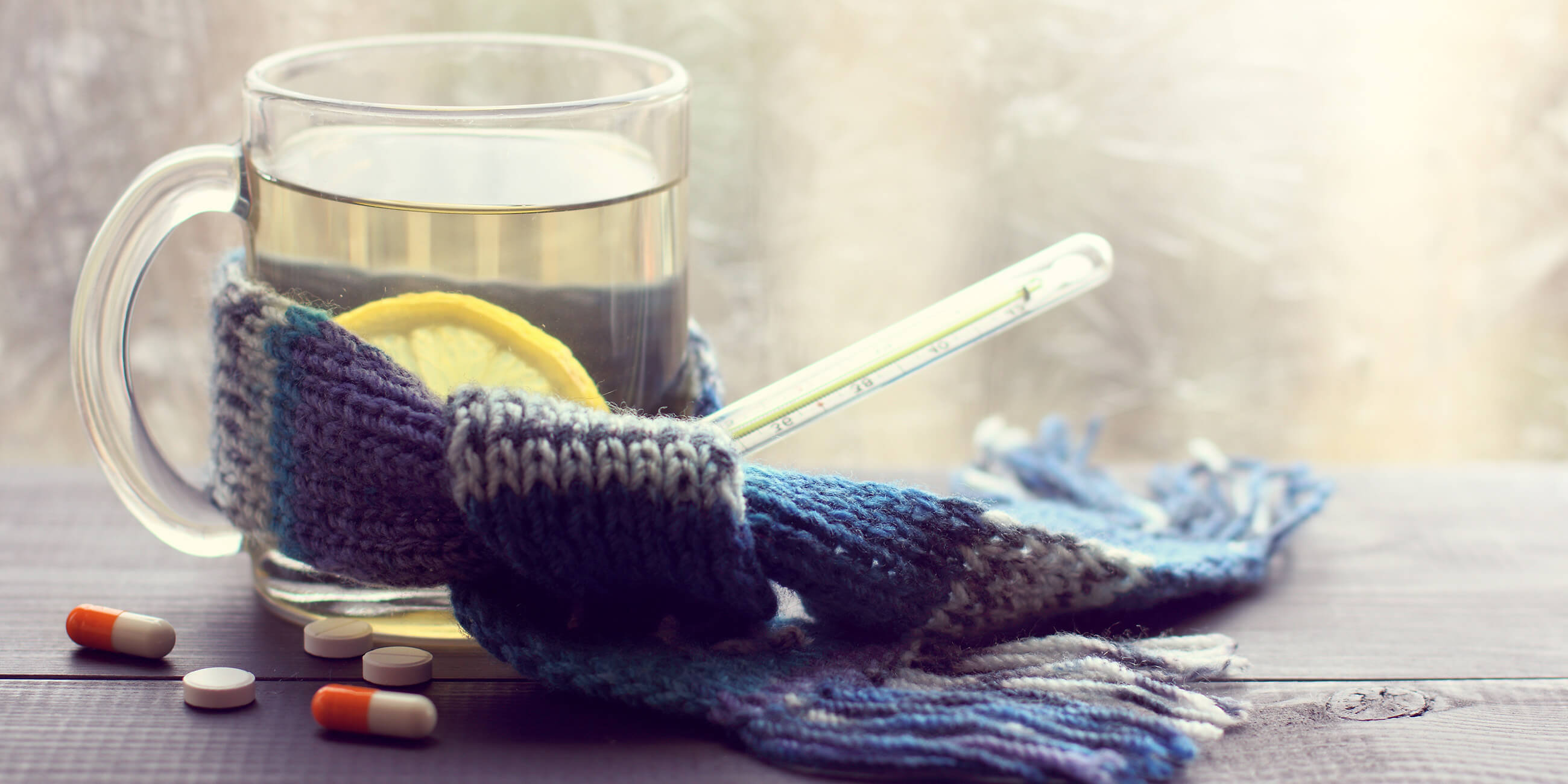 Solgar Capsules alongside lemon water and a scarf