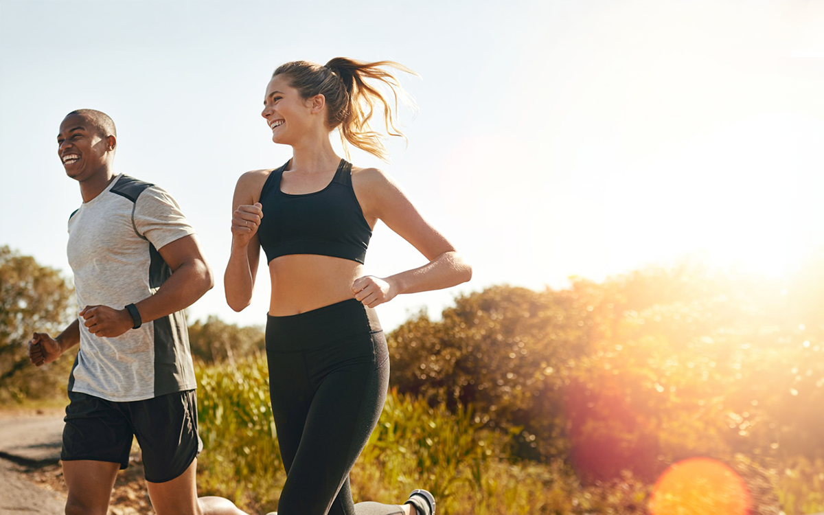 A couple running after taking their Solgar multivitamins