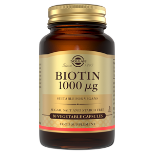 Glass bottle of Solgar Biotin 1000 µg supplements with a gold lid