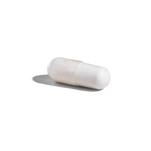 Singular Solgar Biotin 1000 µg capsule on a white surface