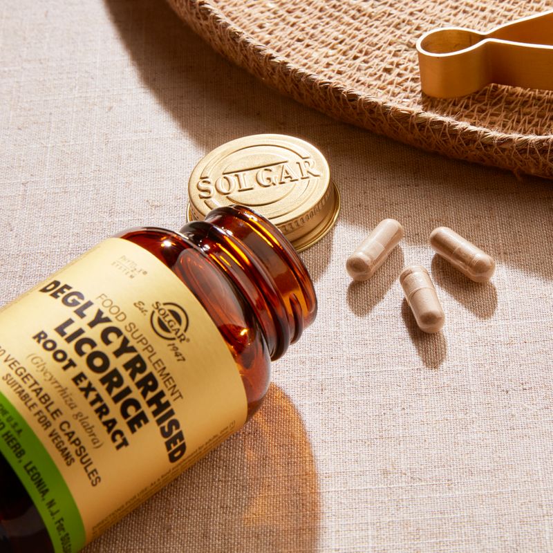 Solgar Deglycyrrhised Licorice Root Extract vegetable capsules in a glass bottle on a table