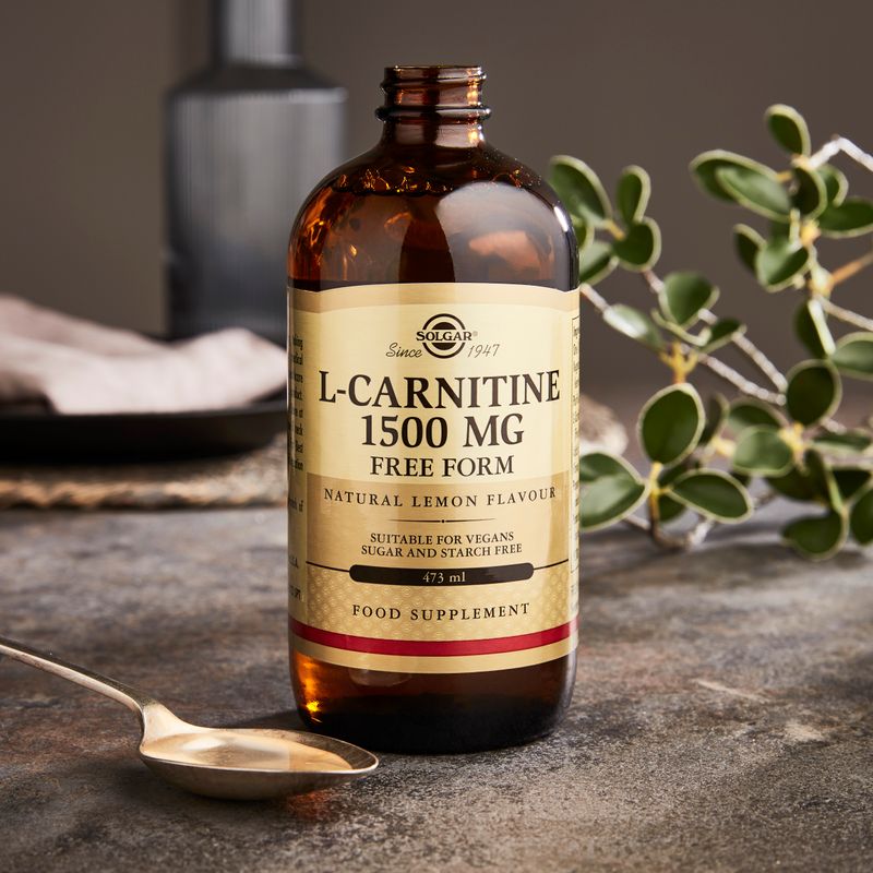 Solgar L-Carnitine 1500 mg Liquid in a 473 ml in a metal bottle on a marble table