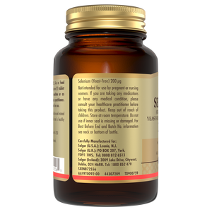 Side view of a glass bottle of Solgar Selenium tablets