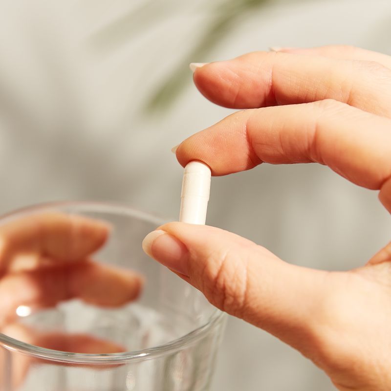 Solgar Vitamin C 500mg capsules in a person's hand