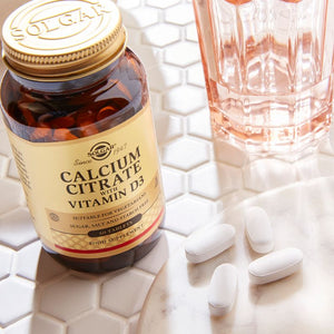 Solgar Calcium Citrate with Vitamin D3 Tablets in a glass bottle on a table