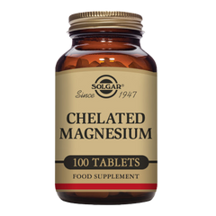 Solgar Chelated Magnesium supplements in a glass jar with a gold lid
