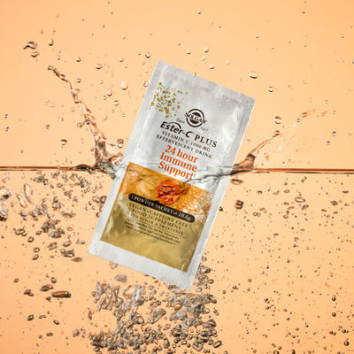 Solgar Ester C-Plus powder sachet packet floating on water 