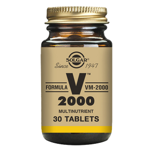 Solgar Formula VM-2000 Multivitamin Tablets in a glass jar with a gold lid