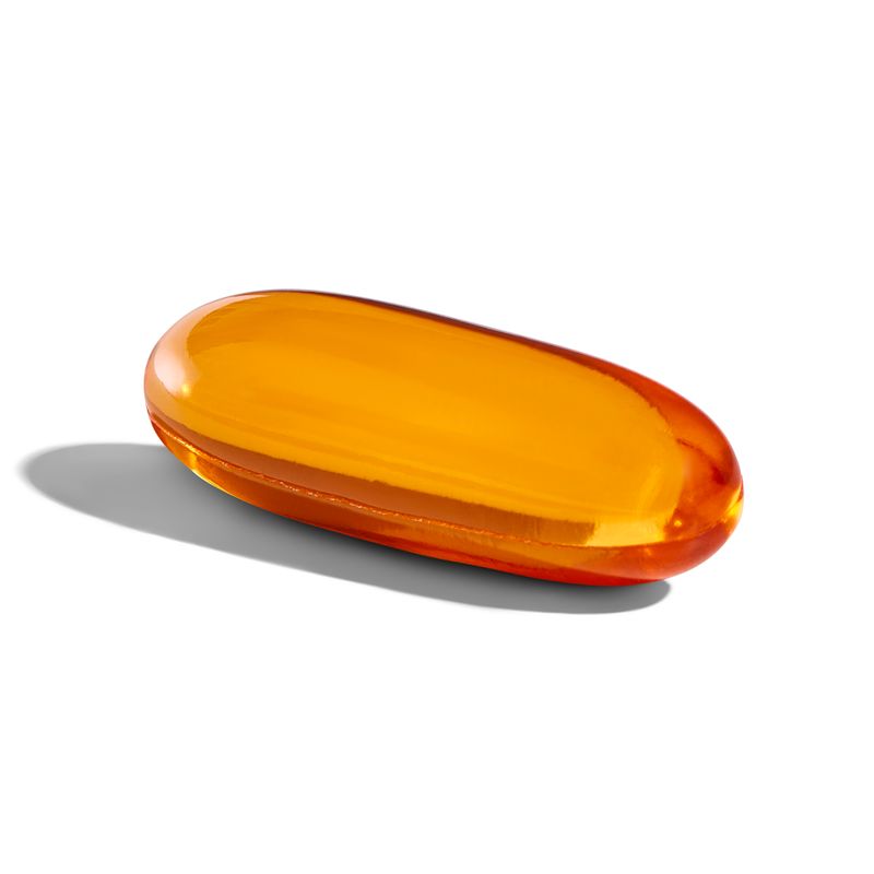 Sngular Solgar Full Spectrum Omega Salmon Oil supplement on a white surface