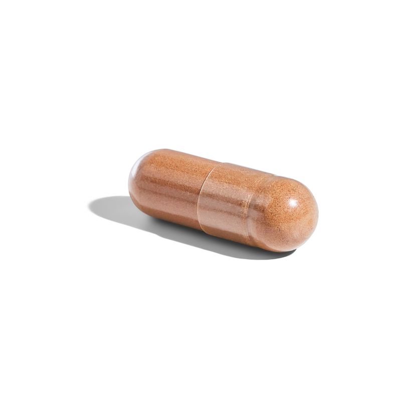 Singular Solgar Green Tea Leaf Extract vegetable capsule on a white surface