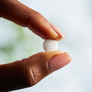 Solgar magnesium with vitamin B6 supplement in a person's hand