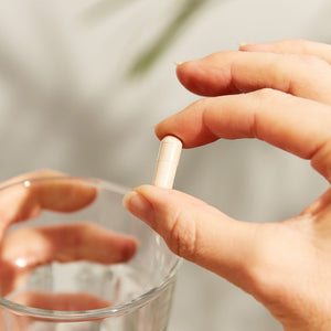 Solgar Psyllium Husks Fibre 500 MG supplement in a person's hand