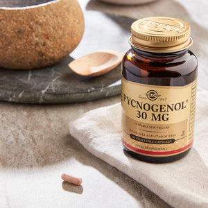  Solgar Pycnogenol 100 mg containing 30 vegetable capsules in a glass bottle on a marble table