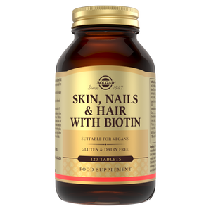 Solgar Skin, Nails & Hair with Biotin supplements in a glass bottle 