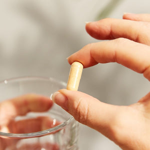 Solgar Vitamin B-complex supplement in a person's hand 