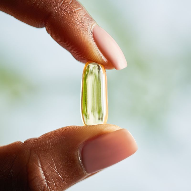 Solgar Vitamin E supplement in a person's hand