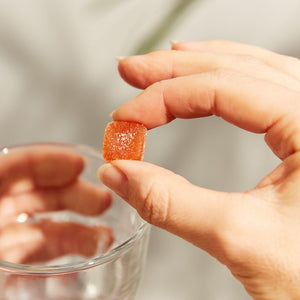 Solgar U-Cubes Children's Multi-Vitamin and Mineral Gummies in a person's hand