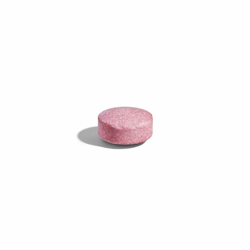 Solgar Methylcobalamin vitamin B12 nugget on a white surface