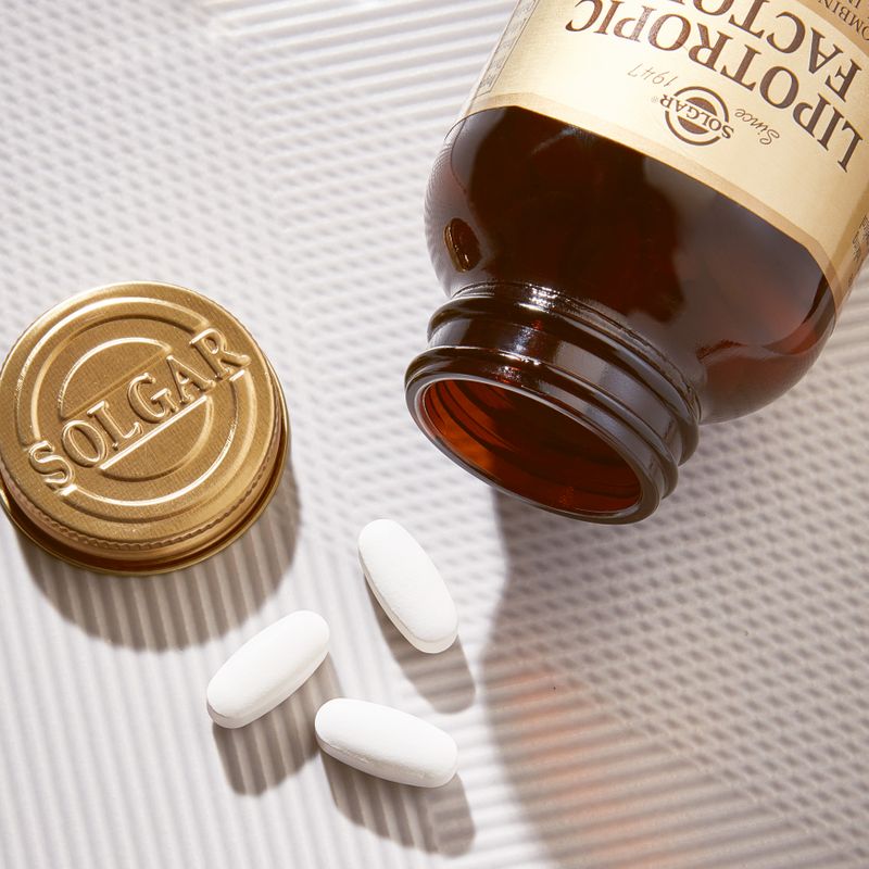 Solgar Lipotropic Factors Tablets in a glass jar on a table