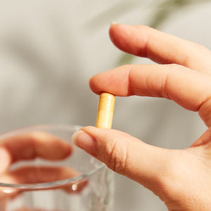 Solgar Vitamin C vegetable capsules in a person's hand